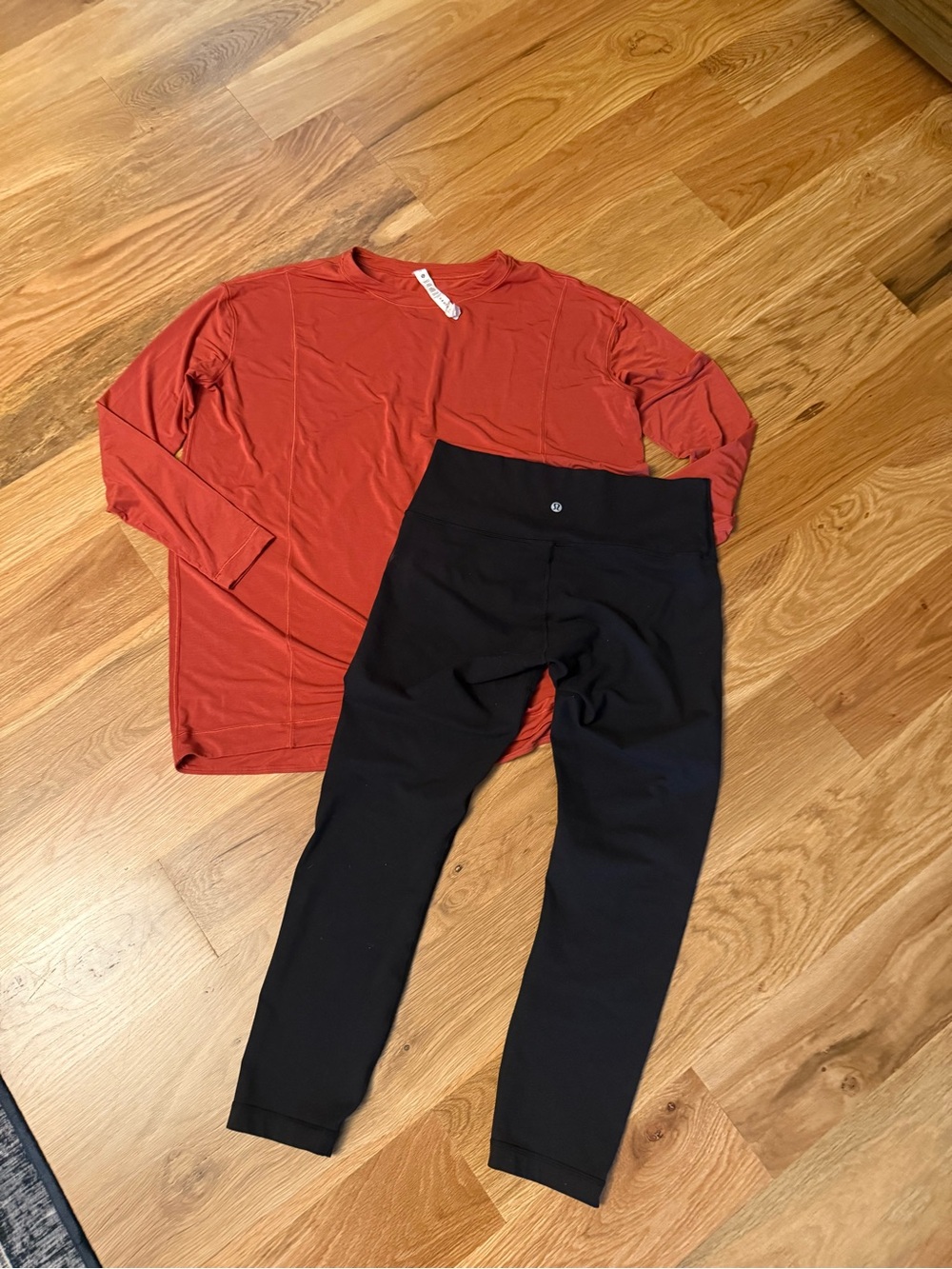 lululemon Black Leggings and orange top